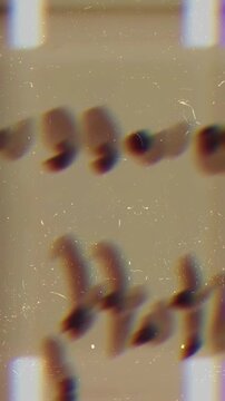 vertical 4k 16mm film scratch and light leak overlay, fast-motion action frames seamless transition loop