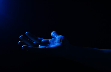 silhouette of a man in the dark. Man hand. Background. Concept. Life. Dark