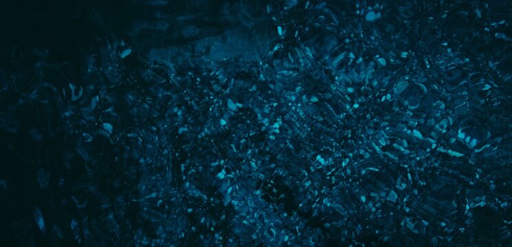 Dark blue small pebbly sea floor 