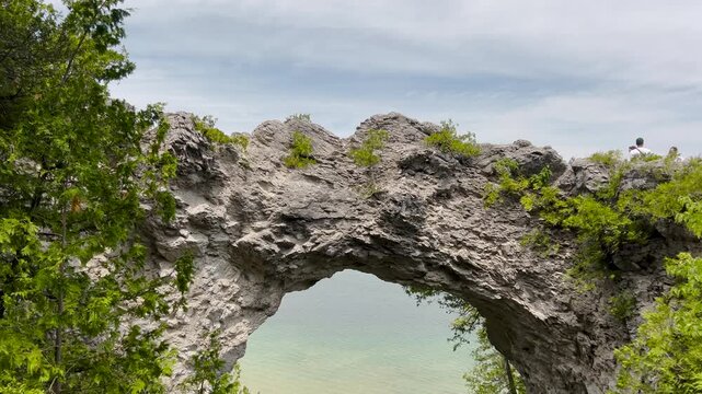 The iconic Arch Rock, Mackinac Island's most famous natural landmark. This limestone arch stands 146 feet above Lake Huron, and was sculpted by the power of water and ice over thousands of years.