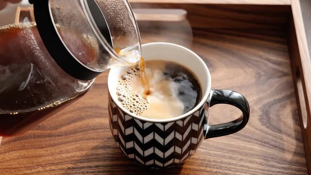 Coffee being poured into a mug
