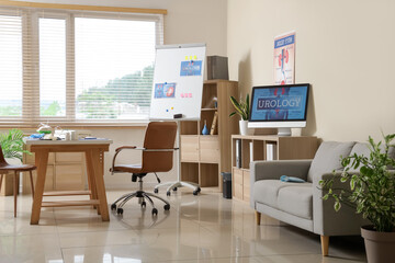 Fototapeta premium Interior of urologist's office with workplace, shelf units and sofa