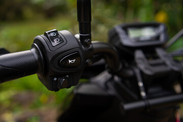 Left handlebar switch control assembly. Includes high-low beam, horn, and turn signal buttons. Responsive tactile feel and weather-resistant durable casing. © Munif Rifa'i
