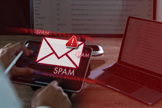 Cybersecurity spam mail concept hacked system spam alert on laptop, representing malicious software, phishing attacks, inbox filtering, secure computer network monitoring.