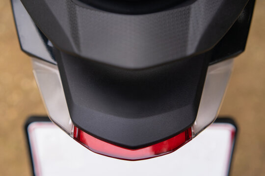 Rear pillion grab rail handle, High-quality cast material with textured grip, Ergonomic design for passenger safety and easy maneuvering.