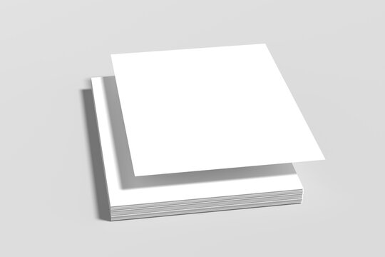 A stack of white A4 paper and blank flyers floats above a grey surface.