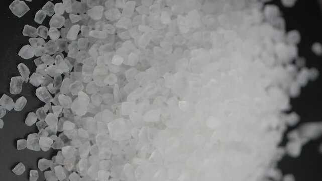 Crystals salt drops on a black background 
