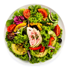 Colorful salad with tuna, lettuce, tomatoes, avocado, peppers, and chickpeas