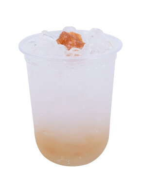 lum soda in a clear glass against a white background.