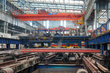 Obraz premium The fiery steel billet, the core moment of the rolling mill production line