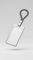 Fototapeta premium Blank luggage tag mockup with plastic coil strap isolated on white background vertical orientation minimalist style