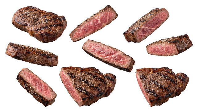 collection of grilled beef steaks and slices seasoned with salt and pepper, variety of cuts and grilling levels, rich texture and aroma, isolated on transparent background