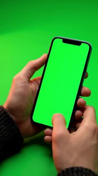 Green Screen 4k man using iphone 12 smartphone viewing on phone press browsing chroma key online typing text reading social media close up hands 24 04 21 st petersburg russia scene 2 with distortion