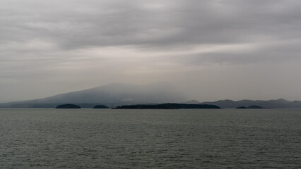 Fototapeta premium Overcast ocean scene with islands and mountain ranges on the BC ferry route to Nanaimo
