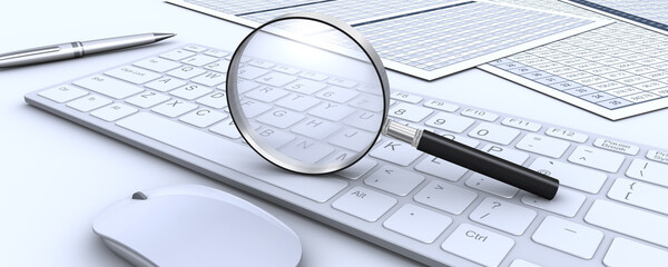 虫メガネとキーボードとビジネス書類