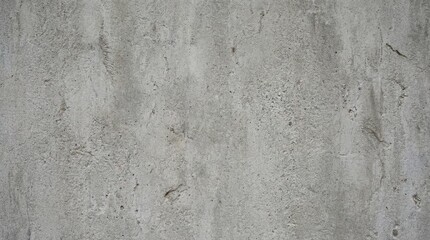 Fototapeta premium Grungy concrete wall with faded paint and rough texture.