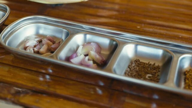 Seasoning ingredients prepared for making Thai chili paste, featuring fresh herbs and spices ready for traditional Thai cooking.
