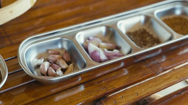 Seasoning ingredients prepared for making Thai chili paste, featuring fresh herbs and spices ready for traditional Thai cooking.