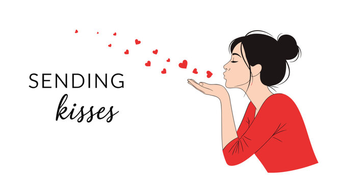 Beautiful young woman in a red shirt blowing a kiss with many small red hearts flying from her hand on a white background.