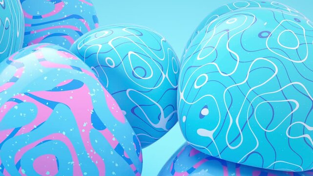 Abstract soft body spheres with blue and pink patterns floating in bright studio space with dynamic motion