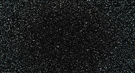Obraz premium black sand texture, dark background, abstract granular surface