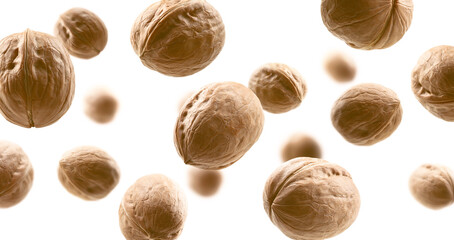 Whole walnuts levitate on a white background