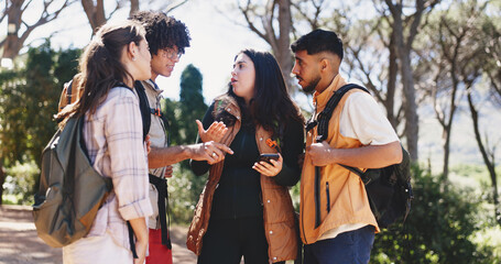 Obraz premium Stress, friends or talk with phone for hiking, route navigation or discussion for trekking trail choice. Lost outdoor, path decision or people with argument for backpacking journey, worry and mobile