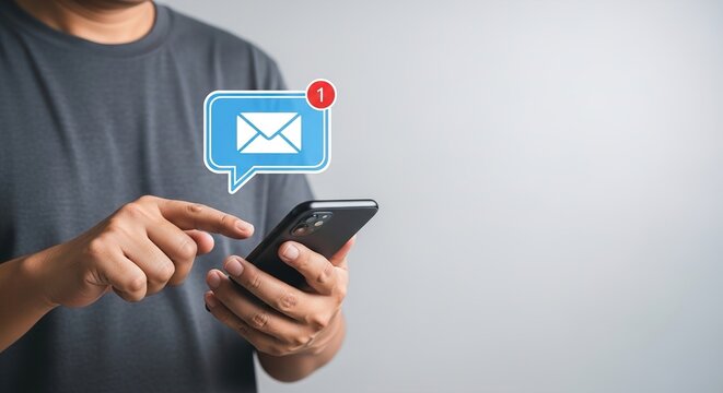 Person using a smartphone receiving a new message notification, highlighting mobile communication and digital interaction.