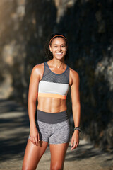 Obraz premium Every day I push myself further. Cropped portrait of an attractive young woman taking a run through the city.