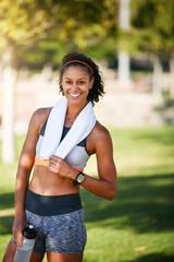 Obraz premium Portrait, woman and smile for fitness outdoor for exercise, endurance training and wellness. Happy, female person and runner with towel, morning routine and sports activity for weight loss in nature