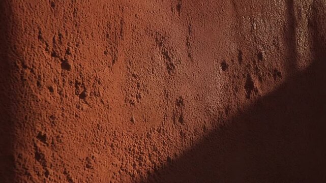 Warm Earthy Texture Background with Dramatic Shadow Play Natural Rough Surface Detail