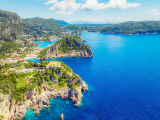 Obraz premium Agios Spiridon Beach with crystal azure water and beach with scenery of coastline of Corfu island near Monastery of Paleokastritsa, Ionian sea in Greece