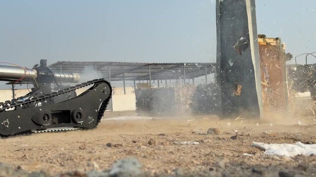 The sapper robot demonstrates the neutralization and destruction of improvised explosive devices. Military exercises. Slow motion. 