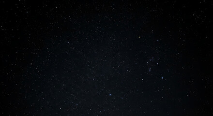 Fototapeta premium Deep space starry night sky with subtle constellations and a faint nebula glow, vast cosmic background