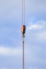 Crane Hook and Cable Against Blue Sky