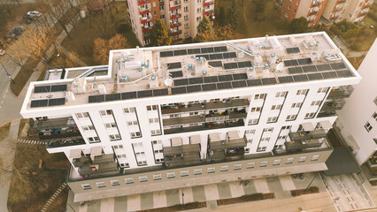 Photovoltaic panels on apartment rooftop for energy