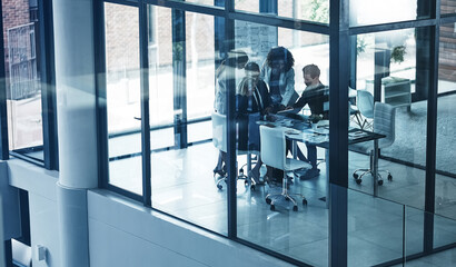 Glass, discussion and group with tablet, boardroom and plan for ad campaign, ideas or collaboration. Marketing team, meeting and people with research, online and productivity for brand awareness