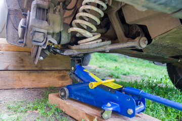 Broken spring in the car suspension.