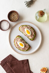 Bruschetta with tuna, avocado and egg. Healthy eating. Breakfast.