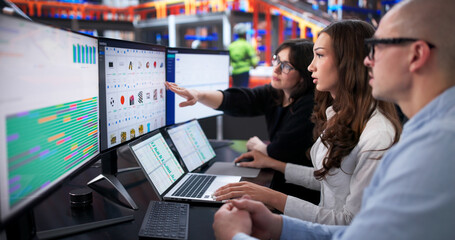Obraz premium Man And Woman Monitor Efficient Logistics Center