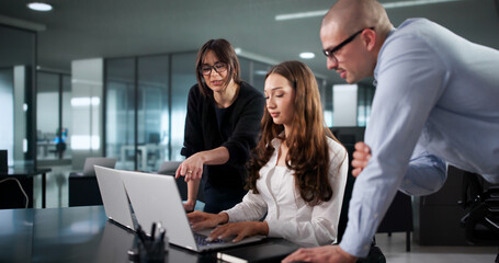 Intense Coding Session: Diverse Team Of Programmers Develop Software Programs