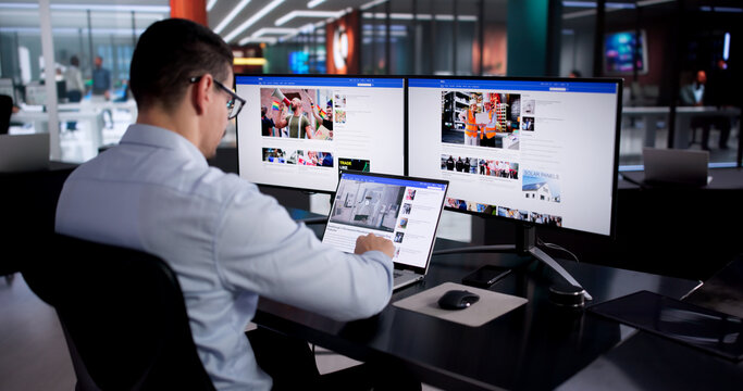 Young Hispanic Digital Journalist Reading Latest Online News Articles