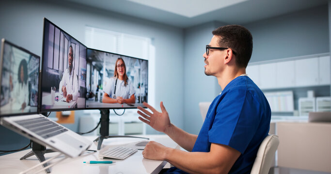 Hispanic Doctor Using Laptop For Remote Telemedicine Conference