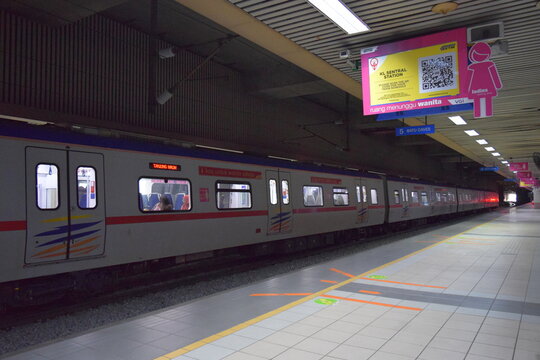 KTM Komuter train at KL Sentral station platform with destination board to Batu Caves, Kuala Lumpur, Malaysia, May 2025 
