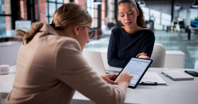 Woman Signing Rent Insurance Contract Using Digital Tablet