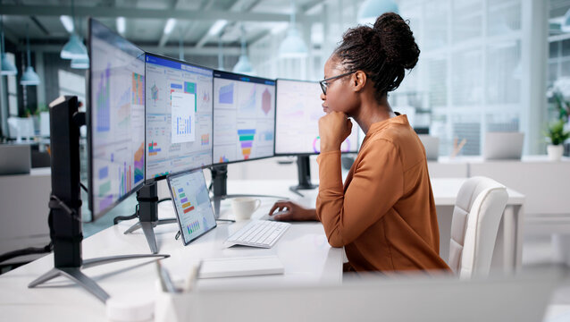 Market Trends Analysis: African American Woman Analyzing Financial Data