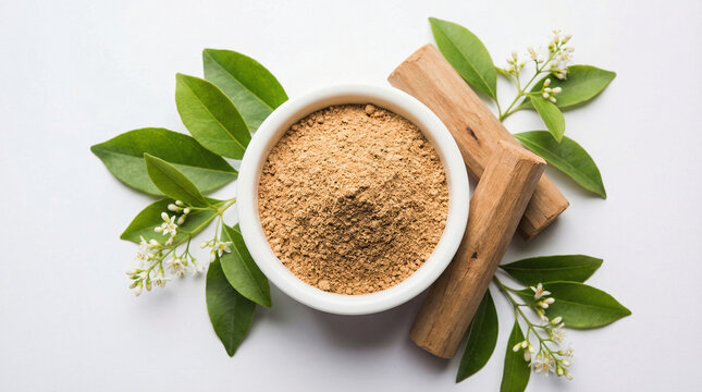 Sandalwood Powder with Natural Sticks and Green Leaves on White Background