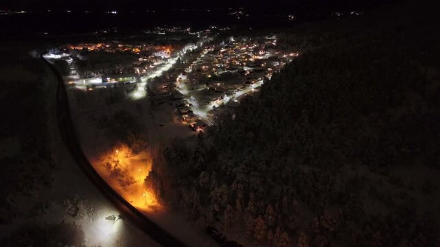 Aerial nighttime view of the suburban area of Storbakken on the island of Freioeya in Kristiansund municipality, Norway.