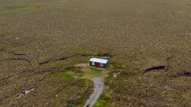 Drone shot of a traditional moorland shieling on the Outer Hebrides of Scotland.