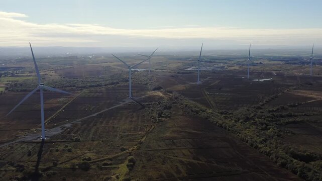 Drone shot of an array of wind turbines in North Lanarkshire, Scotland.